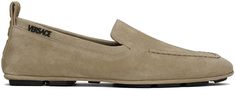 Suede loafers in taupe. · Moc toe · Rubberized logo appliqué at outer side · Logo-embossed pull-loop at heel collar · Buffed calfskin lining · Treaded rubber sole Supplier color: Sand Designer Slip-on Loafers With Stitched Sole, Designer Stitched Sole Slip-on Loafers, Versace Shoes Mens, Luxury Slip-on Loafers With Textured Sole, Luxury Suede Slip-on Loafers, Luxury Semi-formal Loafers With Suede Lining, Versace Mens Shoes, Versace Shoes, Color Sand