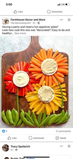 a wooden cutting board with carrots and peppers on it