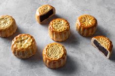 several small pastries with different designs on them