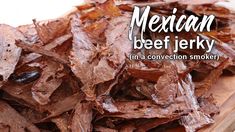 mexican beef jerk in a convection smoker on a cutting board with text overlay