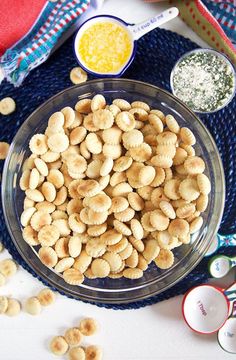 a glass bowl filled with cashews next to other ingredients