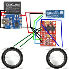 an electronic device with two speakers attached to it and wires connected to each other,