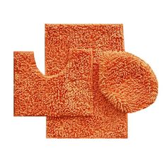 three pieces of orange bathroom rugs on grey background