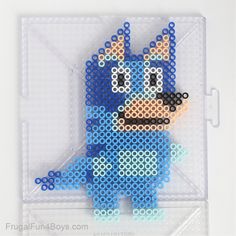 a plastic bead toy with a blue dog on it