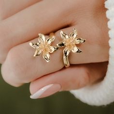 Title: Lily Ring  Story:  Elevate your style with the timeless beauty of our Lily Flower Ring, a mesmerizing piece of 3D printed jewelry that captures the essence of delicate lilies in bloom. Crafted with precision using advanced 3D printing technology, this adjustable ring showcases the intricate details of the flower petals, bringing a touch of natural elegance to your ensemble. With its adjustable design, this ring offers a comfortable and personalized fit, making it a versatile accessory for Gold Jewelry With 3d Petal Flowers, Lily Ring Jewelry, Flower Gold Ring, Lily Ring, Lily Jewelry, 3d Printed Jewelry, Printed Jewelry, Classy Jewelry, Nature Inspired Jewelry