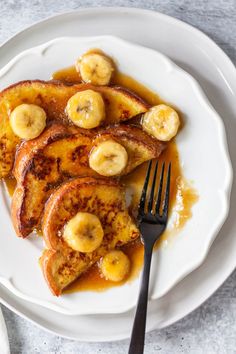 banana fosterer french toast on a white plate with syrup