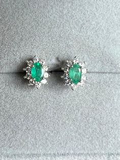 One of our favorites.  A 925 sterling silver set of oval cut green emeralds with halos of diamonds, all natural.  These earrings are a perfect gift for yourself or someone you love.  They are originally from Bordeaux and are in perfect condition.   6mm x 5mm each  Gift Box Free Shipping USA Opal Statement Ring, Green Topaz, Lexington Kentucky, Colombian Emeralds, Topaz Earrings, Green Diamond, Mystic Topaz, Diamond Stud Earrings, Emerald Earrings