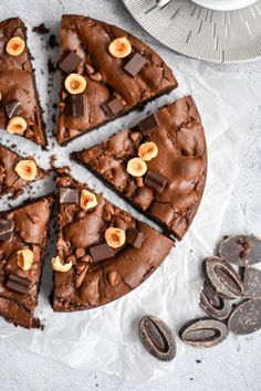 a chocolate cake with slices cut out on top of it