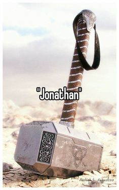 an old hammer with a snake on it and the words jonathan written in black ink