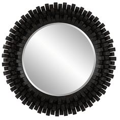 a round mirror is shown with black wood trimmings on the edges and sides