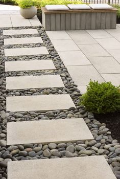 a walkway made out of stones and gravel