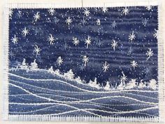 a piece of cloth with snowflakes on it and trees in the background,