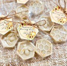 soaps wrapped in wax and tied with twine on top of a tablecloth