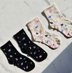 "\"Cute Universe Socks, Moon And Stars Socks, Retro Planets Sock, Galaxy Inspired Socks, Fun Space Socks, Novelty Socks, Cosmos Socks Gift Set\" Behold, the perfect way to express your adoration for the cosmos! Feast your eyes on these darling socks, printed with a celestial dance of moon and stars. Who says you can't pamper yourself? Bestow your toes with the delight of our popular blend of Polyester and Elastane, and set out on your adventures as the most charming explorer of the year with the cutest socks you'll find. Our Out Of Space socks are crafted to cradle any feet, with a one-size-fits-all enchantment. Infuse any outfit with a kaleidoscope of colors, bewitching the gaze of all who behold you! Whether you're dancing through the world or lounging with your cadre, these universe ins Space Socks, Style Kawaii, Socks Gift, Cute Socks, Novelty Socks, Moon And Stars, Sock Gifts, Casual Socks, Socks And Hosiery