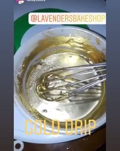 there is an image of a mixing bowl with whisk and liquid in it