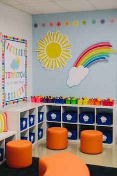 a classroom with colorful furniture and decorations on the walls