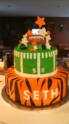 a football themed cake on a table