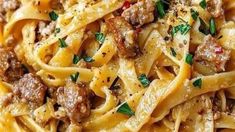 pasta with meat and parmesan cheese on top