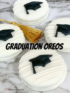 graduation oreos are decorated with white icing and black tassels on them