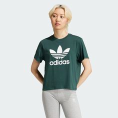 adidas Shop the Adicolor Trefoil Boxy Tee - Green at adidas.com/us! See all the styles and colors of Adicolor Trefoil Boxy Tee - Green at the official adidas online shop. Adidas Logo Summer Top, Summer Adidas Logo Top, Adidas Green Sportswear Top, Adidas Logo Tops, Adidas Logo Athleisure Tops With Relaxed Fit, Sporty Logo Print Cropped T-shirt For Spring, Casual Green T-shirt With Adidas Logo, Green Athleisure Tops With Three Stripes Branding, Green Cropped T-shirt For Streetwear