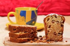 slices of cake sitting on top of a plate next to a cup