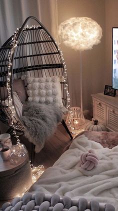 a bedroom with a hammock chair and lights