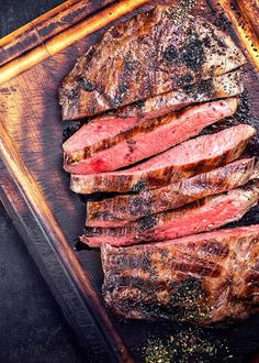 steaks and rosemary wagyu flat iron steak on a grill with the title balsamic and rosemary wagyu flat iron steak