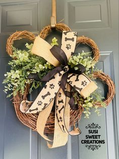 a dog themed wreath hanging on the front door