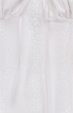 Sugar and spice come to play in this cotton-blend corset edged in lilts of lace and cinched with a laced-up detail and side zip for easy-on convenience. Sweetheart neck Wired cups 65% cotton, 32% nylon, 3% elastane Dry clean Imported Delicate Lace Fitted Bodice Corset, Delicate Lace Fitted Corset, White Lace Overbust Corset, White Underbust Corset With Lace Bodice, White Lace Bodice Underbust Corset, White Fitted Corset With Lace Trim, White Underbust Corset With Lace Trim, White Lace Trim Underbust Corset, Cotton Corset