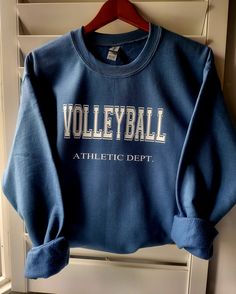 Unisex Varsity Letters Volleyball Sweatshirt. Cozy time with this beautiful soft sweatshirt, layer it up or simply wear it with shorts and sweats. Sport your sweatshirt for training day, game day, coffee run, or as your fav streetwear. Unisex sizing Indigo Blue, Gray, Navy blue, Mustard yellow 50% cotton, 50% polyester Leisure Sportswear Tops With Letter Print, Blue Letter Print Sweatshirt For Leisure, Blue Sporty Tops For Leisure, Sporty Blue Tops For Leisure, Sporty Moisture-wicking Tops For Leisure, Casual Sportswear Tops, Sporty Crew Neck Leisure Top, Sporty Crew Neck Top For Leisure, Sporty Sweatshirt With Letter Print