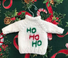 a white sweater with the words ho ho written on it