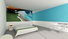 a room with a bed, desk and painting on the wall above it that has a car painted on the wall