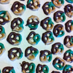 there are many donuts that have been decorated with chocolate and green icing on them