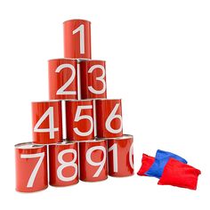 a stack of red numbered numbers next to a blue and red flag on a white background