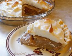 a slice of pie on a plate next to another pie