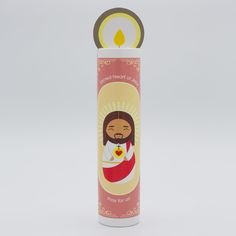 a candle with the image of jesus on it in a canister shaped like a candle