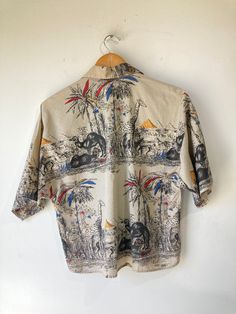 Vtg SOHO Giraffe patterned shirt. In excellent condition. Made in USA. No size marked. Approx. Measurements: 20" underarms 24" length Patterned Top With Camp Collar And All Over Print, Patterned Camp Collar Top With All Over Print, Patterned Top With All Over Print And Camp Collar, Patterned Relaxed Fit Shirt With Camp Collar, Vintage Short Sleeve Top With All Over Print, Vintage Summer Tops With All Over Print, Relaxed Fit Patterned Shirt With Retro Print, Fitted Printed Hawaiian Shirt With Camp Collar, Patterned Shirt With Spread Collar In Relaxed Fit