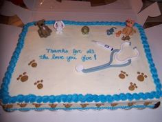 a sheet cake decorated with animals and a stethoscope