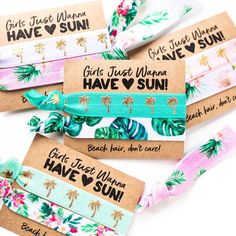 four different colored headbands with palm trees on them and the words girls just wanna have sun printed on them