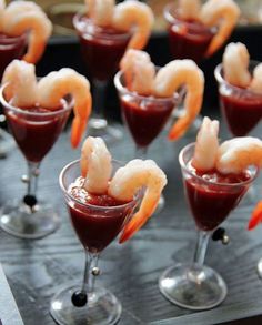 an image of food in glasses with shrimp on top