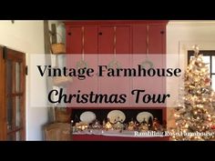 an old fashioned christmas tree in front of a red cabinet with the words vintage farmhouse christmas tour