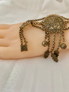 "Etruscan Revival Festoon Necklace and Bracelet Set Gold Tone Ornate Vintage Patina Necklace - 16.5\" plus festoon drop with dangles additional 4\" Length Bracelet - 7.5\" Bracelet medallion 1.76x x 1.50@ No markings Aged patina, can use white vinegar to brighten if preferred" Vintage Festival Jewelry With Adjustable Chain, Vintage Festival Bracelet Jewelry, Vintage Festival Jewelry Bracelet, Ornate Adjustable Antique Gold Jewelry, Bohemian Metal Bracelets With Latkans, Metal Bracelets With Latkans For Festival, Ornate Metal Bracelets For Festival, Vintage Metal Bracelets For Festivals, Festive Antique Style Metal Bracelets