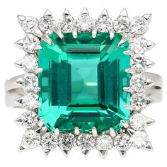 an emerald and diamond cocktail ring