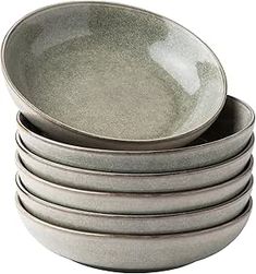 a stack of gray bowls sitting on top of each other