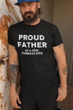 "Showcase your dad's unique sense of humor and celebrate his love for his mischievous offspring with our \"Proud Father Of A Few Dumbass Kids\" T-Shirt. This hilarious and light-hearted tee is the perfect gift for Father's Day, Dad's birthday, or any occasion when you want to bring a smile to his face. Crafted with care, our t-shirt is made from high-quality, soft fabric that ensures optimal comfort throughout the day. Its classic unisex fit is designed for both men and women, allowing anyone to Funny T-shirt For Birthday And Father's Day, Fun Father's Day T-shirt With Graphic Print, Father's Day T-shirt With Funny Print, Fun Graphic Print T-shirt For Father's Day, Fun Crew Neck T-shirt For Father's Day, Pre-shrunk Fun T-shirt For Father's Day, Funny Letter Print T-shirt For Father's Day, Father's Day T-shirt With Funny Text, Dads Birthday