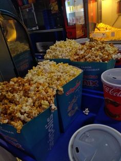 three boxes of popcorn and two cups of soda