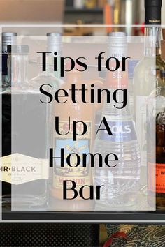 bottles of liquor sitting on top of a counter with the words tips for setting up a home bar