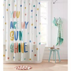 a shower curtain with the words you are my sun shine on it in multicolored polka dots