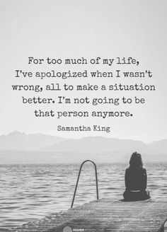 a woman sitting on top of a pier next to the ocean with a quote about life