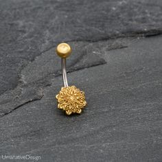 Tribal, Beautiful Flower Mandala Belly Button Ring Material : 316L Surgical Steel Pin, Top ball and the bottom disc is made of 22k Gold Plated Brass. Top ball's diameter is: 0.19 Inch - 5mm Bottom disc's diameter is: 0.37 Inch - 9.3mm Pin is : 14g - 1.6mm thick and 0.47 Inch - 11.5mm long *Nickel Free You can find more belly piercing at this link- https://www.etsy.com/shop/Umanativedesign?section_id=16522336&ref=shopsection_leftnav_5 All of our Umanative Design jewelry are hand made with lov Adjustable Gold Belly Rings For Wedding, Gold Belly Button Rings, Unique Nose Rings, Gold Ear Climbers, Bellybutton Piercings, Belly Button Piercing Jewelry, Belly Bar, Belly Button Jewelry, Indian Nose Ring